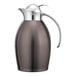 A brown and silver stainless steel Service Ideas Nicollet coffee carafe with a push button lid.