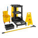 A black Lavex janitor cart with mop bucket, bags, lid, caddy, wet floor sign, and 12 mop heads.
