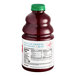 A close-up of a Dr. Smoothie Classic Strawberry Fruit Smoothie Mix bottle with a green lid.