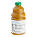 A bottle of Dr. Smoothie Classic Mango fruit smoothie mix with a label on it.