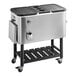 A stainless steel Choice beverage cooler cart with two trays on wheels.
