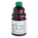 A bottle of Dr. Smoothie Classic Four Berry Blend fruit smoothie mix with a green cap.