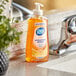 A case of Dial Professional gold liquid hand soap with aloe sitting on a counter.