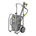 A close-up of a grey Karcher electric cold water pressure washer with yellow handles.