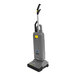 A grey Karcher Sensor XP upright vacuum cleaner with a yellow handle and black wheels.