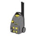 A grey and yellow Karcher commercial steam cleaner.