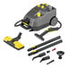 A grey and yellow Karcher commercial steam cleaner with accessories.