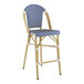 A blue and white striped Lancaster Table & Seating outdoor barstool.