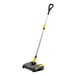 A black and yellow Karcher lithium-ion floor sweeper.