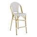 A gray Lancaster Table & Seating Bistro outdoor counter height barstool with a white seat.