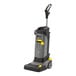 A grey and yellow Karcher walk-behind cylindrical floor scrubber.