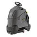 A Karcher Chariot 2 iScrub floor scrubber with wheels and a handle.