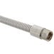 A T&S stainless steel flex hose with a metal nut on the end and a polyurethane liner.