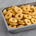 A tray of Brakebush Gold'N'Spice Chik'N O's chicken nuggets on a table.