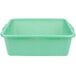 A green plastic Vollrath Traex drain box.