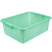 A green plastic Vollrath Traex drain box.