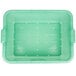 A green plastic Vollrath Color-Mate drain box with holes.