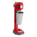 AvaMix red and silver drink mixer with a metal cup on top.