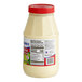 A white plastic bottle of McCormick Mayonesa Mayonnaise with a red lid.