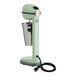 A seafoam green AvaMix drink mixer with a metal spindle and cord.