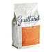 A white bag of Guittard L'Etoile du Nord Semi-Sweet Wafers with orange and black text.