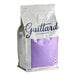 A white bag of Guittard milk chocolate wafers with purple text and a purple label.