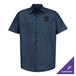 A navy blue short sleeve men's industrial work shirt with two chest pockets and customizable options.