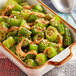 A dish of Goya IQF cut okra with sauce.