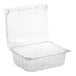 A D&W Fine Pack clear plastic clamshell produce container with a lid.