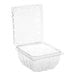 A D&W Fine Pack clear plastic clamshell produce container with a lid.