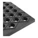 A heavy-duty black rubber anti-fatigue floor mat with a diamond pattern and circular holes.