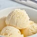 A bowl of Tillamook French Vanilla ice cream with two scoops.