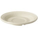 A white saucer with a ribbed edge.