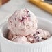 A bowl of Tillamook Oregon Dark Cherry ice cream with a spoon.