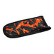 A black and orange cloth pot handle cover with a red and black chili pepper pattern.