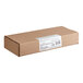A brown cardboard box with a white label for White Toque Gluten-Free Cheese and Raspberry Tartlets.