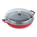 A red pot with a round base and a glass lid.