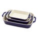 A stack of three blue and white rectangular Staub baking dishes.