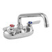 A Krowne Silver Series wall-mount faucet with lever handles and a swing nozzle.