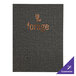 A close-up of a Milan menu cover with a purple and white logo.