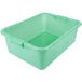 A green plastic Vollrath Traex bus tub with handles.