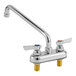 A Krowne Silver Series deck-mount faucet with a 12" swing nozzle and lever handles.
