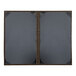 Two grey rectangular H. Risch, Inc. leather menu covers with brown edges.