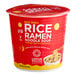 A red container of Lotus Foods Red Miso Rice Ramen with a white label and yellow lid filled with noodles.