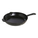 A black Staub enameled cast iron skillet with a handle.