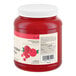 A large plastic jar of crushed maraschino cherries with a white lid and product label.