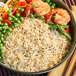 A bowl of Lotus Foods long grain white basmati rice with shrimp.