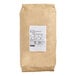 A brown bag of Lotus Foods Organic Long Grain White Jasmine Rice with a white label.