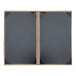 A black rectangular menu cover with brown corners.