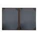 Two black and brown rectangular H. Risch, Inc. Milan menu covers with black frames.